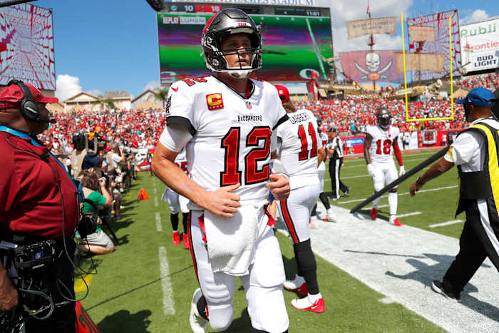 Oct 10, 2021; Tampa, Florida, USA; Tampa Bay Buccaneers quarterback Tom Brady (12) runs to the sidelines as they scored a touchdown against the Miami Dolphins during the second quarter at Raymond James Stadium. Mandatory Credit: Kim Klement-USA TODAY Sports